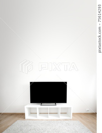 Lcd tv on white shef at modern room interior. Copy space Lcd tv on white shef at modern room interior. Copy space 75614293