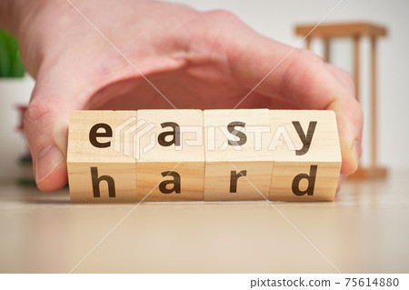 The concept of changing the degree of difficulty is easy and hard on wooden cubes The concept of changing the degree of difficulty is easy and hard on wooden cubes 75614880