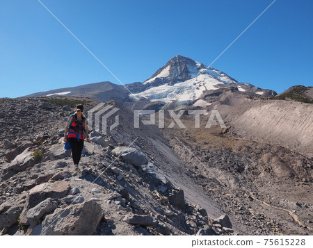 Woman on the Timberline Trail on Mount Hood, Oregon. Woman on the Timberline Trail on Mount Hood, Oregon. 75615228