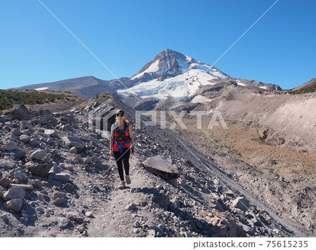 Woman on the Timberline Trail on Mount Hood, Oregon. Woman on the Timberline Trail on Mount Hood, Oregon. 75615235