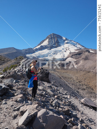 Woman on the Timberline Trail on Mount Hood, Oregon. Woman on the Timberline Trail on Mount Hood, Oregon. 75615241