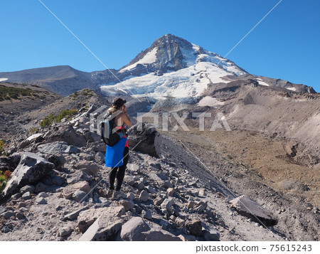 Woman on the Timberline Trail on Mount Hood, Oregon. 75615243