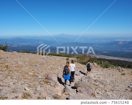 Hikers on the Timberline Trail on Mount Hood, Oregon. Hikers on the Timberline Trail on Mount Hood, Oregon. 75615248
