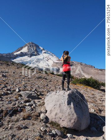 Woman on the Timberline Trail on Mount Hood, Oregon. 75615254