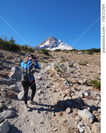 Woman on the Timberline Trail on Mount Hood, Oregon. Woman on the Timberline Trail on Mount Hood, Oregon. 75615264