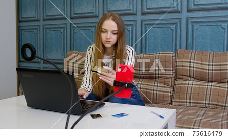Woman ordering food, making shopping payments purchases from bank credit card on laptop computer Woman ordering food, making shopping payments purchases from bank credit card on laptop computer 75616479
