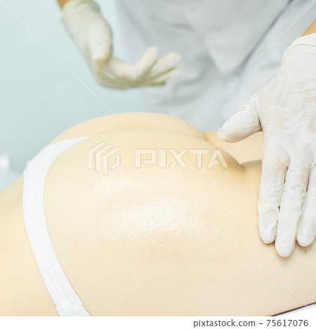Body massage with oil. Doctor cosmetologist hands. Anti cellulite Body massage with oil. Doctor cosmetologist hands. Anti cellulite 75617076