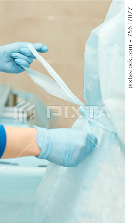 Ophthalmology laser microscope operation. Clinic room with doctor and parient. Gloves and medicine tools Ophthalmology laser microscope operation. Clinic room with doctor and parient. Gloves and medicine tools 75617077