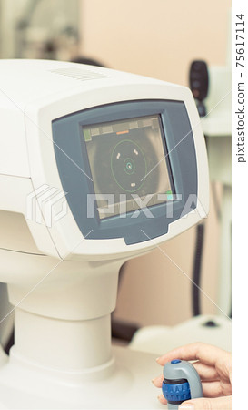 ophthalmologist doctor in exam optician laboratory. Men eye care medical 75617114