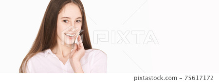 Female teenager person. Cleansing dirty skin. Remove mascara. Cotton pad face 75617172