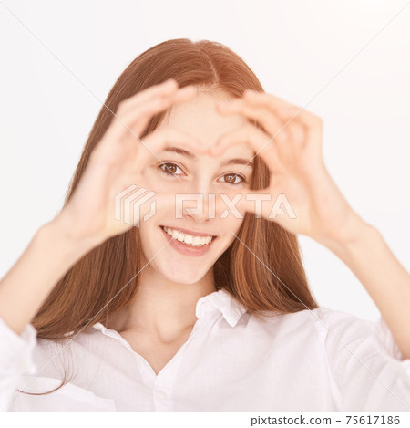 Heart hands near face. Positive emotion model. Ophthalmology concept 75617186