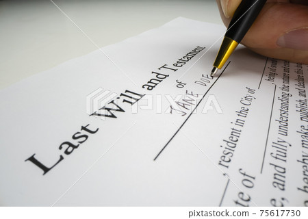 Close-up view of writing a last will Close-up view of writing a last will 75617730