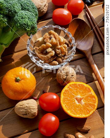 Fresh organic vegetables, fruits, nuts, spoons and chopsticks Fresh organic vegetables, fruits, nuts, spoons and chopsticks 75619712