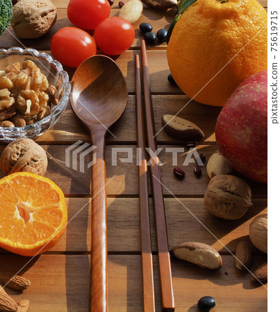Fresh organic vegetables, fruits, nuts, spoons and chopsticks Fresh organic vegetables, fruits, nuts, spoons and chopsticks 75619715