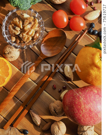 Fresh organic vegetables, fruits, nuts, spoons and chopsticks Fresh organic vegetables, fruits, nuts, spoons and chopsticks 75619717