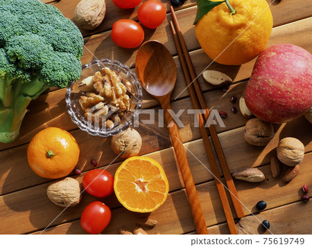 Fresh organic vegetables, fruits, nuts, spoons and chopsticks Fresh organic vegetables, fruits, nuts, spoons and chopsticks 75619749
