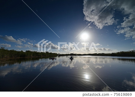 Woman kayaking on Nine Mile Pond in Everglades National Park, Florida. 75619869