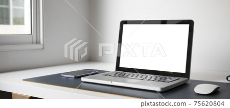 Horizontal photo of modern workplace with computer laptop and smart phone. Horizontal photo of modern workplace with computer laptop and smart phone. 75620804