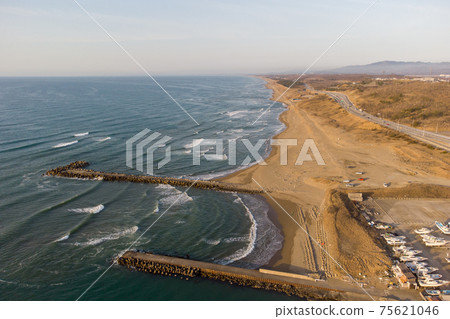 [Kahoku-gun, Ishikawa Prefecture] Aerial view of Noto Satoyama Kaido with Uchinada sand dunes Fishing port side 75621046