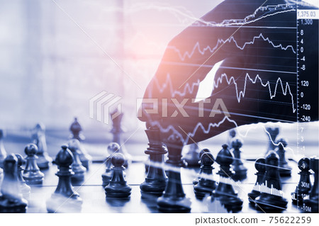 Chess game on chess board behind business man background. Business concept to present financial information and marketing strategy analysis. Investment target in global economy and digital commercial. 75622259