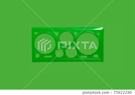 green plastic transparent ruler on green background 75622290