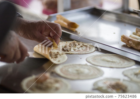 Thai dessert (Khanom Tokyo), Pancake roll stuffed with minced pork Thai dessert (Khanom Tokyo), Pancake roll stuffed with minced pork 75623486