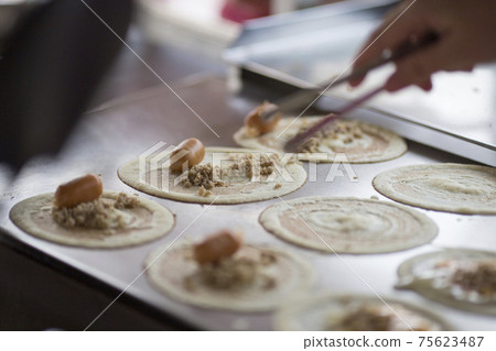 Thai dessert (Khanom Tokyo), Pancake roll stuffed with minced pork Thai dessert (Khanom Tokyo), Pancake roll stuffed with minced pork 75623487