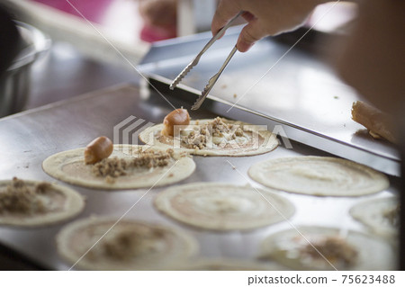 Thai dessert (Khanom Tokyo), Pancake roll stuffed with minced pork Thai dessert (Khanom Tokyo), Pancake roll stuffed with minced pork 75623488