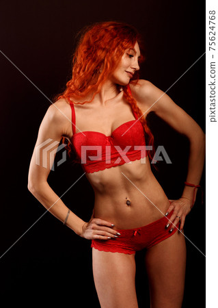 Redhead sexy cabaret dancer in lingerie on a... - Stock Photo [75624768]