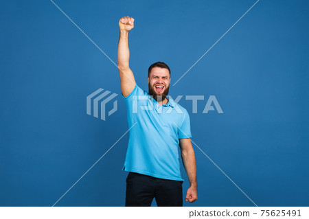 Caucasian man's portrait isolated on blue studio background with copyspace 75625491