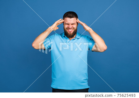 Caucasian man's portrait isolated on blue studio background with copyspace 75625493