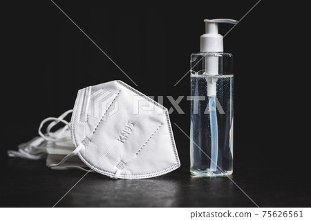 Coronavirus prevention hand sanitizer and kn95 respirator mask. Hand disinfectant gel in pump bottle. 75626561