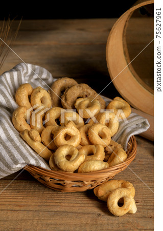 Taralli - traditional Italian snack food typical of Apulia regional cuisine Taralli - traditional Italian snack food typical of Apulia regional cuisine 75627961