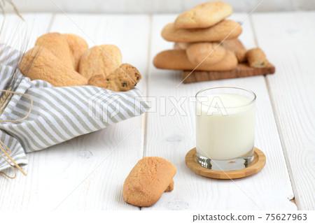 Freshly baked homemade crunchy cookies with glass of milk 75627963