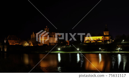 Castle of the Teutonic Order by night in Malbork, Pomerania, Poland Castle of the Teutonic Order by night in Malbork, Pomerania, Poland 75631517