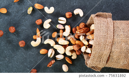 Raw various nuts, top down view. Raw various nuts, top down view. 75631892