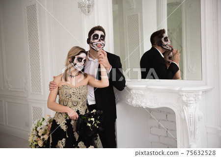 Halloween Zombie party and horror. Halloween couple with makeup 75632528