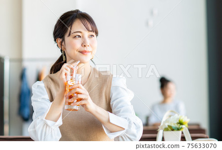 A young woman relaxing in a cafe A young woman relaxing in a cafe 75633070