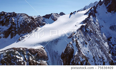 High snow-capped peaks and glaciers from the top. High snow-capped peaks and glaciers from the top. 75636409
