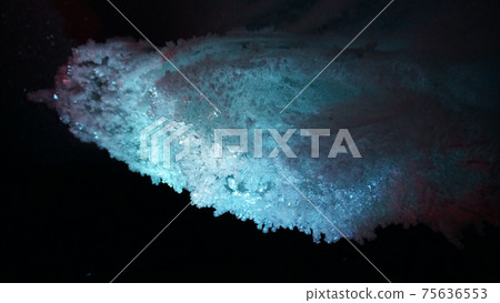 In an ice cave with colored lighting from lanterns In an ice cave with colored lighting from lanterns 75636553
