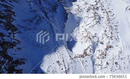 A huge wall of ice. Glacier in the mountains. A huge wall of ice. Glacier in the mountains. 75636651