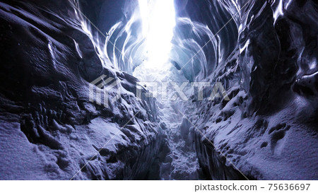 Light at the exit of the ice cave. 75636697