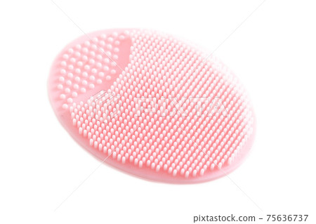 Pink silicone cosmetic facial brush on a white background, isolate. Skin care, macro Pink silicone cosmetic facial brush on a white background, isolate. Skin care, macro 75636737