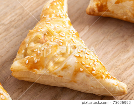 Golden crispy slices with ham and cheese on wooden kitchen board, close-up. Homemade Golden crispy slices with ham and cheese on wooden kitchen board, close-up. Homemade 75636993