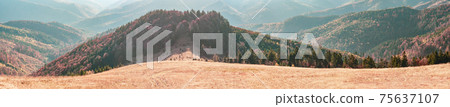 Panorama View from high mountain on picturesque landscape autumn Carpathian. Dramatic sky. Ukraine, Europe. Majestic sunset in mountains landscape. Panorama View from high mountain on picturesque landscape autumn Carpathian. Dramatic sky. Ukraine, Europe. Majestic sunset in mountains landscape. 75637107