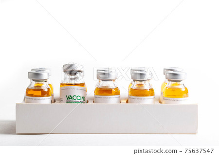 Looped. Flasks of vaccine for COVID-19 coronavirus in research lab. Vaccination, injection, clinical trial during pandemic, macro 75637547