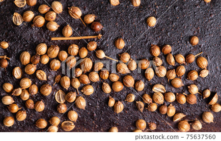 Delicious black bread with coriander seasoning, macro. Healthy and high-calorie bread, background Delicious black bread with coriander seasoning, macro. Healthy and high-calorie bread, background 75637560