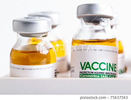 Vials of coronavirus medicine are in packaging on a white background. Vaccine test concept in a laboratory, macro Vials of coronavirus medicine are in packaging on a white background. Vaccine test concept in a laboratory, macro 75637563