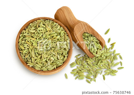Dried fennel seeds in wooden bowl isolated on white background with clipping path. Top view. Flat lay 75638746