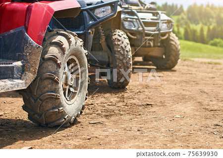Quadricycles or quadbikes in the summer mountains Quadricycles or quadbikes in the summer mountains 75639930
